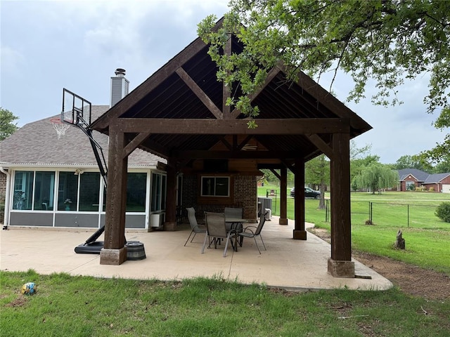 surrounding community featuring a lawn, fence, a gazebo, and a patio area