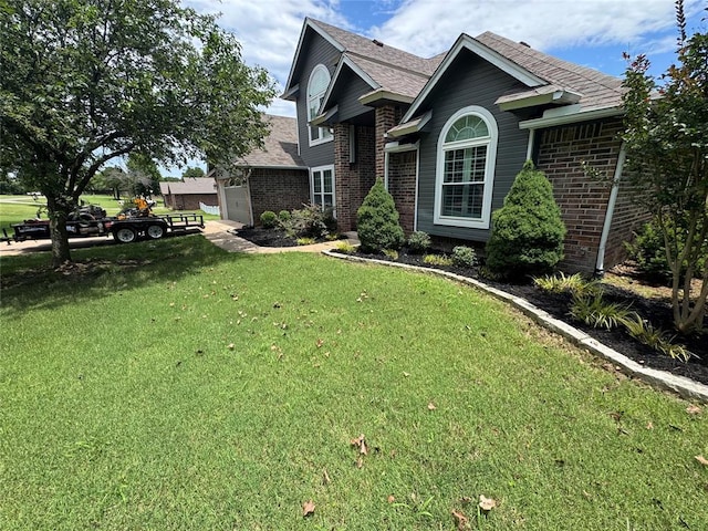 7900 Double Springs Dr, Oklahoma City, OK 73150 - view of front of property featuring brick siding, a front lawn, and a shingled roof