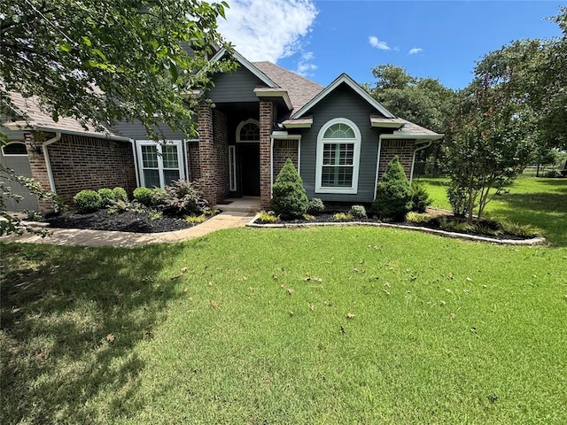 7900 Double Springs Dr, Oklahoma City, OK 73150 - view of front facade featuring a front yard and brick siding