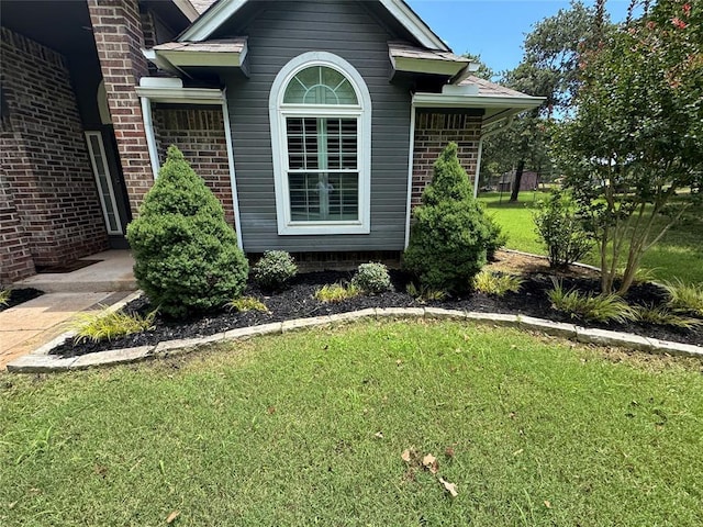 7900 Double Springs Dr, Oklahoma City, OK 73150 - view of home's exterior featuring a yard and brick siding