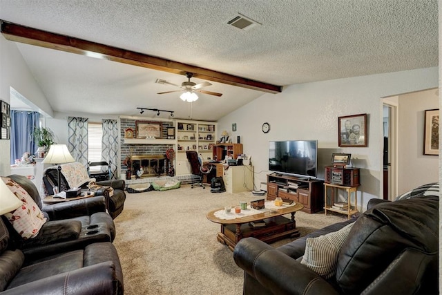 living room featuring visible vents, a brick fireplace, carpet flooring, lofted ceiling with beams, and a ceiling fan