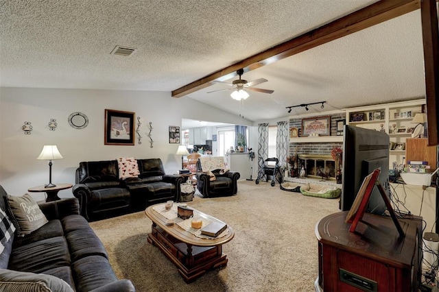 living area with vaulted ceiling with beams, carpet, a textured ceiling, and visible vents