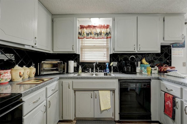 kitchen featuring white cabinets, a sink, dishwasher, decorative backsplash, and a toaster