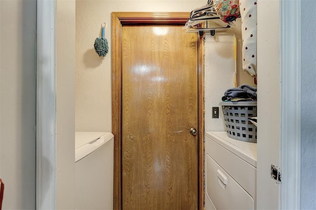 laundry area with separate washer and dryer and laundry area