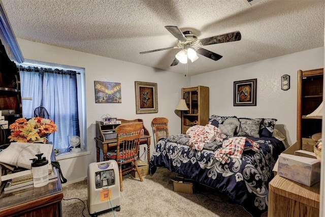 bedroom with carpet flooring, a ceiling fan, and a textured ceiling