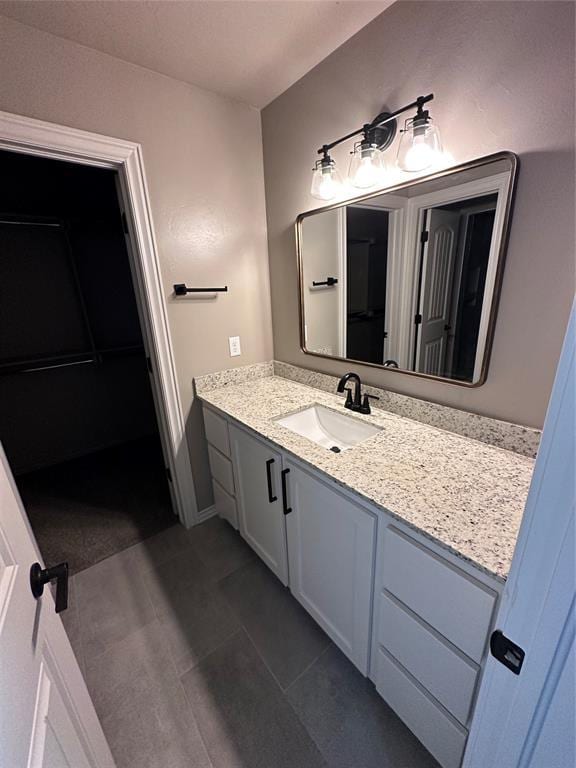 bathroom featuring tile patterned floors and vanity