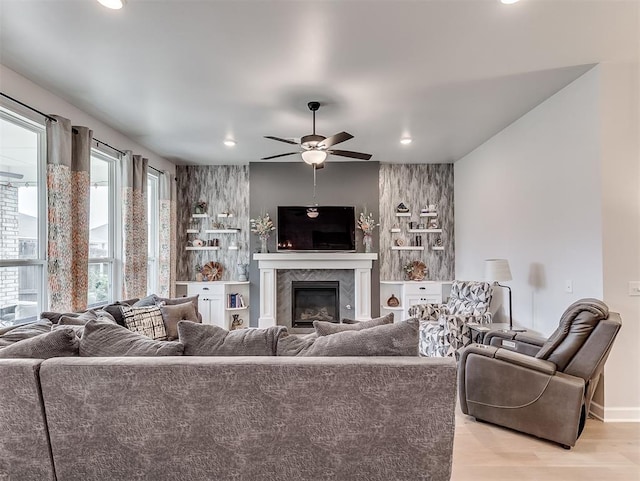 15936 Buffalo Dr, Oklahoma City, OK 73170 - living room with recessed lighting, ceiling fan, light wood-style floors, and a fireplace