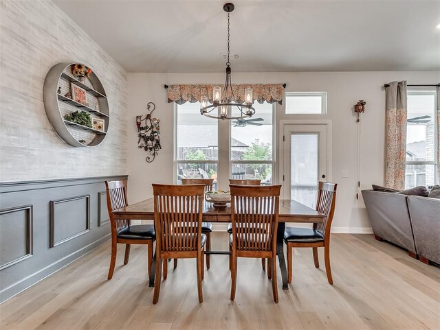 15936 Buffalo Dr, Oklahoma City, OK 73170 - dining space with light wood-style floors, a chandelier, and baseboards