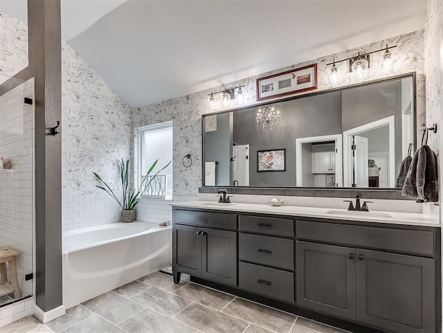 15936 Buffalo Dr, Oklahoma City, OK 73170 - bathroom with a garden tub, a stall shower, a sink, and wallpapered walls