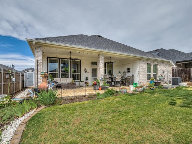 15936 Buffalo Dr, Oklahoma City, OK 73170 - back of property with ceiling fan, a yard, a fenced backyard, cooling unit, and roof with shingles
