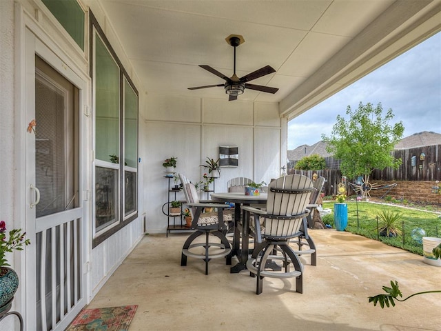15936 Buffalo Dr, Oklahoma City, OK 73170 - view of patio / terrace with a ceiling fan, outdoor dining space, and fence