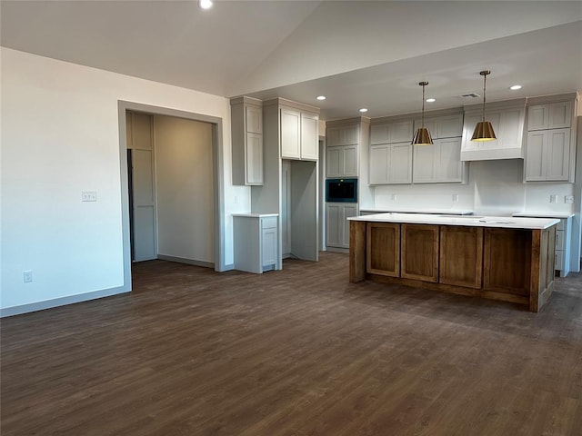 211 Shavano St, Shawnee, OK 74804 - kitchen with built in microwave, dark wood-style floors, recessed lighting, baseboards, and a center island