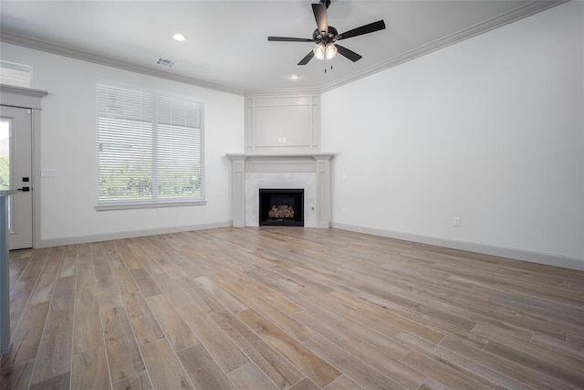 2909 SW 132nd St, Oklahoma City, OK 73170 - unfurnished living room with ceiling fan, light wood-style flooring, a fireplace, and ornamental molding