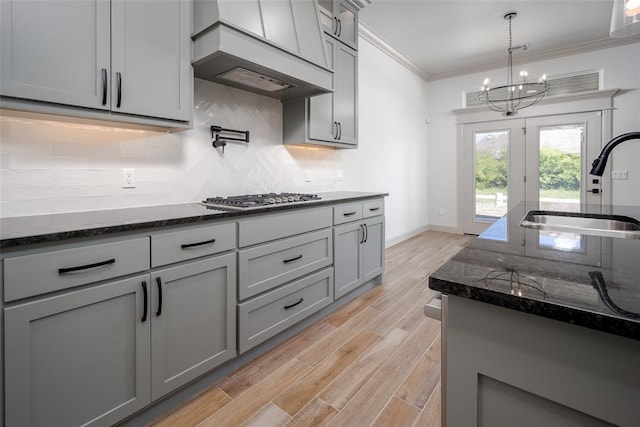 2909 SW 132nd St, Oklahoma City, OK 73170 - kitchen featuring custom range hood, gray cabinets, stainless steel gas cooktop, and a sink