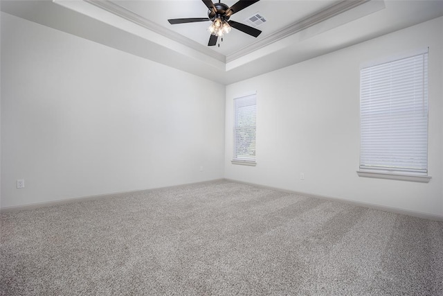 2909 SW 132nd St, Oklahoma City, OK 73170 - spare room with a tray ceiling, visible vents, a ceiling fan, carpet floors, and ornamental molding
