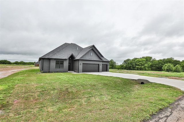 view of front of house with board and batten siding, a front yard, brick siding, concrete driveway, and an attached garage