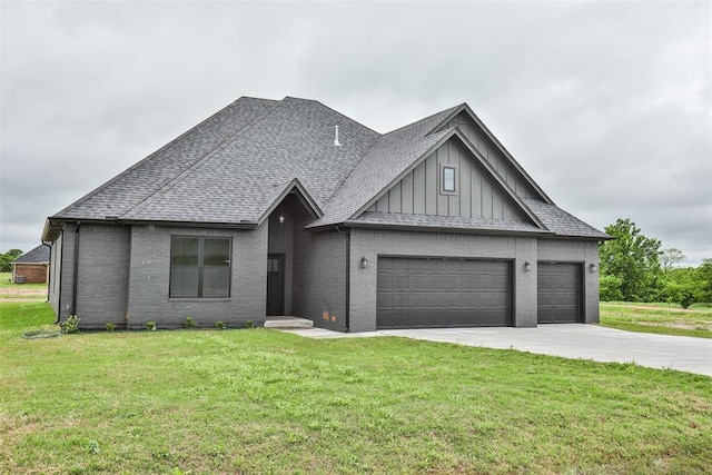 view of front facade with a garage, a front yard, brick siding, board and batten siding, and concrete driveway