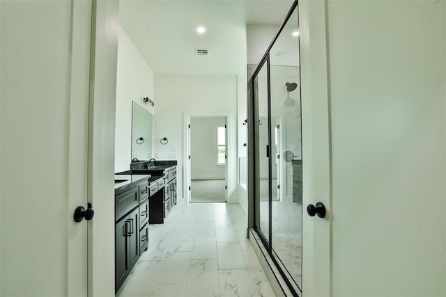 bathroom with vanity, visible vents, marble finish floor, and a stall shower