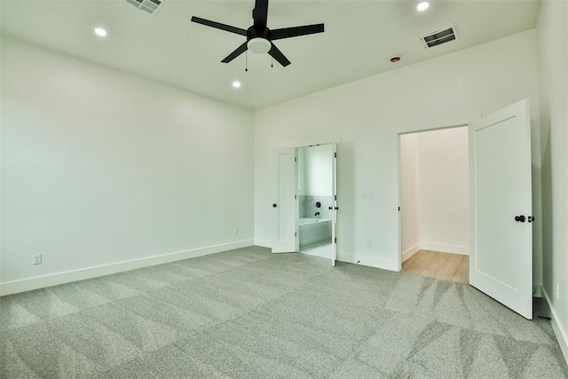unfurnished bedroom featuring carpet flooring, recessed lighting, and visible vents