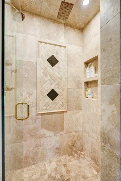 bathroom featuring a shower stall