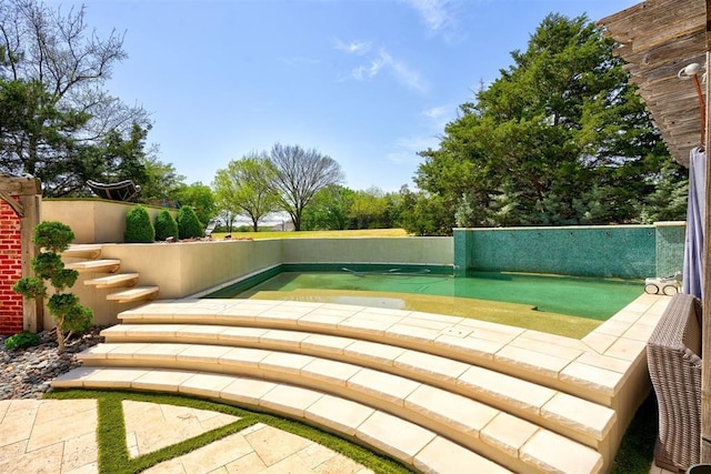 view of pool with fence
