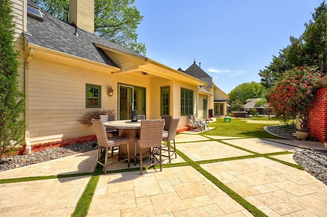 view of patio featuring outdoor dining area