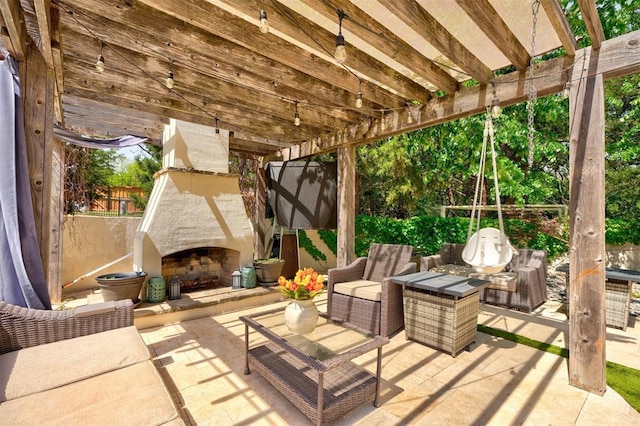 view of patio / terrace featuring an outdoor living space with a fireplace and a pergola