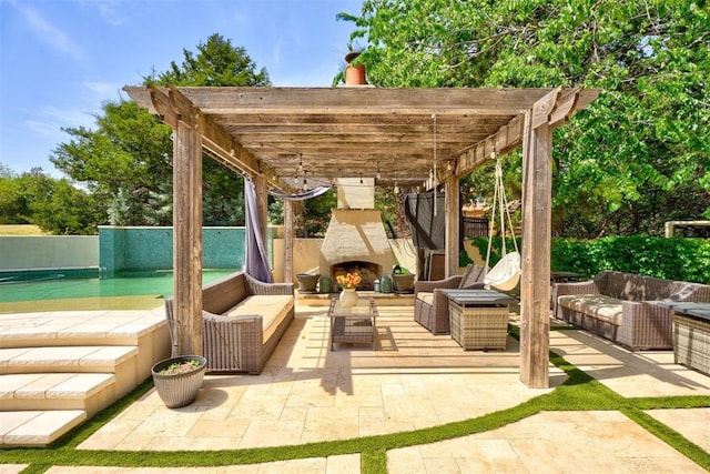 view of patio featuring fence, an outdoor living space with a fireplace, and a pergola