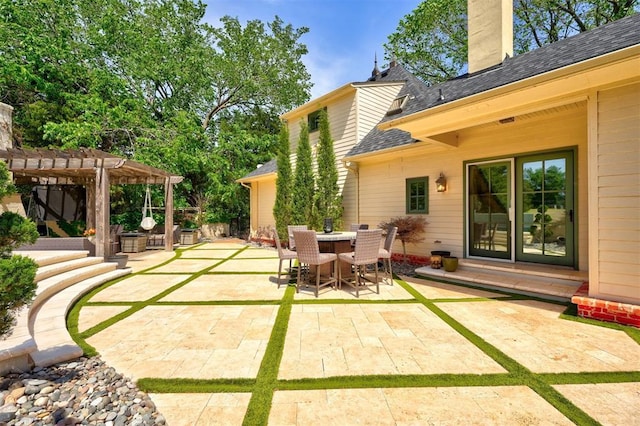 view of patio featuring a pergola and outdoor dining area