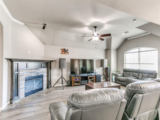 13612 Calabria Trl, Oklahoma City, OK 73170 - living area featuring a ceiling fan, wood finished floors, a fireplace, lofted ceiling, and visible vents