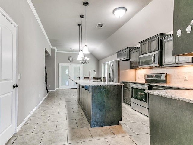 13612 Calabria Trl, Oklahoma City, OK 73170 - kitchen with light tile patterned floors, stainless steel appliances, visible vents, and a sink