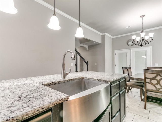 13612 Calabria Trl, Oklahoma City, OK 73170 - kitchen with decorative light fixtures, visible vents, ornamental molding, and a sink