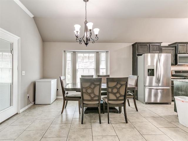 13612 Calabria Trl, Oklahoma City, OK 73170 - dining space with a chandelier, lofted ceiling, baseboards, and light tile patterned flooring