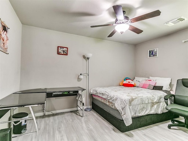 13612 Calabria Trl, Oklahoma City, OK 73170 - bedroom with baseboards, a ceiling fan, wood finished floors, and visible vents