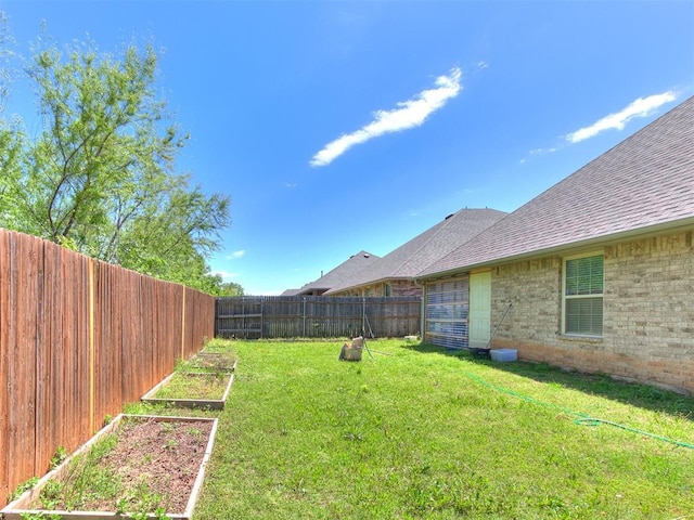 13612 Calabria Trl, Oklahoma City, OK 73170 - view of yard with a garden and a fenced backyard