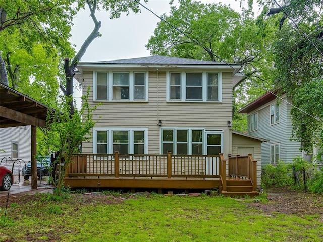 back of house with a yard and a deck