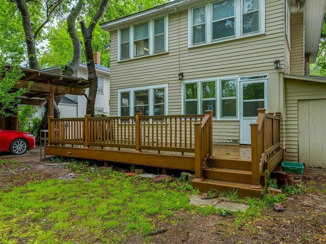 rear view of property with a wooden deck