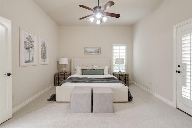 bedroom featuring baseboards, multiple windows, and carpet flooring
