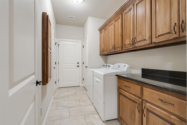 washroom with separate washer and dryer, cabinet space, marble finish floor, baseboards, and visible vents