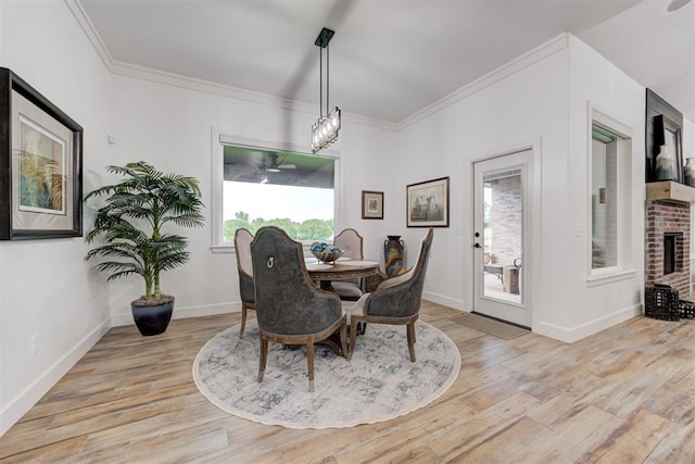 dining area with baseboards, light wood-style flooring, and plenty of natural light