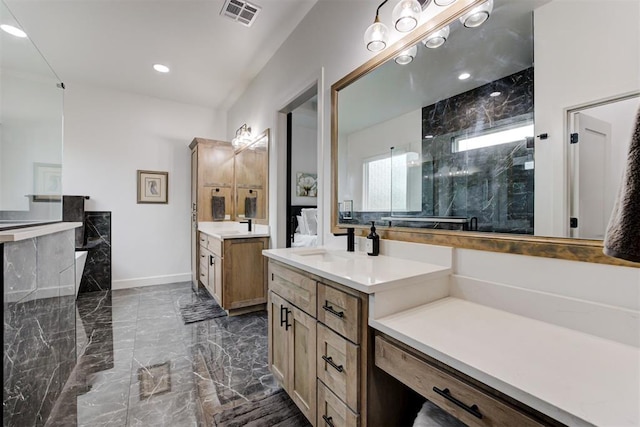 full bath with a walk in shower, two vanities, marble finish floor, a sink, and visible vents