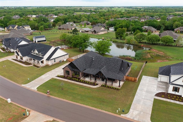 bird's eye view featuring a residential view and a water view