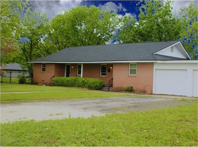 107 S 10th St, Davis, OK 73030 - ranch-style home featuring a garage, asphalt driveway, brick siding, and a front yard