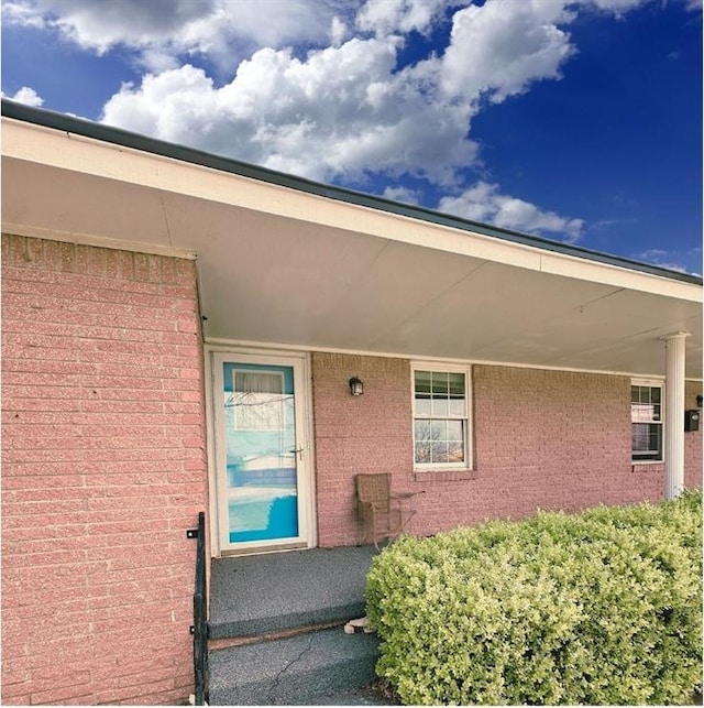 107 S 10th St, Davis, OK 73030 - doorway to property featuring brick siding