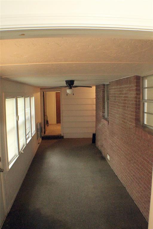 107 S 10th St, Davis, OK 73030 - view of unfurnished sunroom