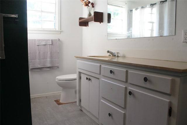 107 S 10th St, Davis, OK 73030 - full bath featuring vanity, toilet, healthy amount of natural light, and a shower with shower curtain