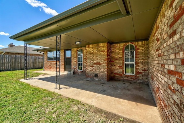 view of patio featuring fence