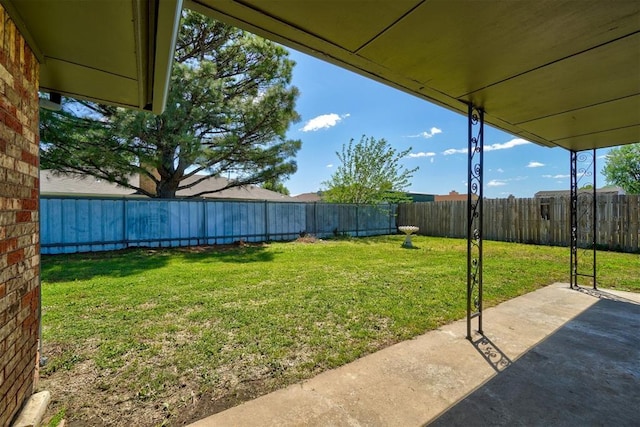 view of yard with a fenced backyard and a patio area
