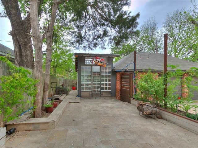 725 NE 15th St, Oklahoma City, OK 73104 - view of patio featuring a fenced backyard