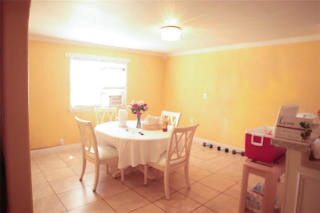 607 E Liveoak St, Altus, OK 73521 - dining space with crown molding, baseboards, and light tile patterned floors